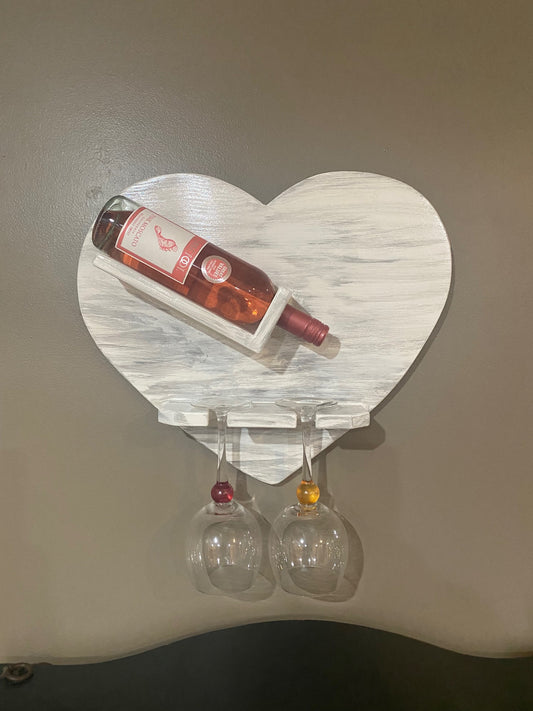 whitewashed wooden heart wine rack that holds two glasses 