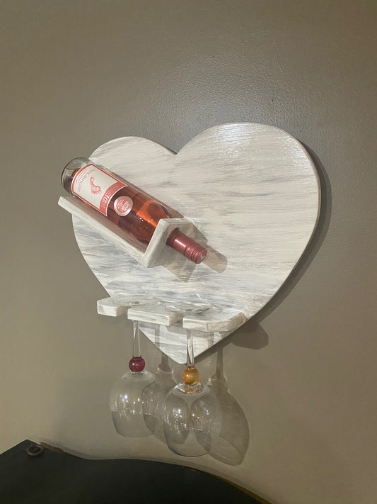 whitewashed wooden heart wine rack that holds two glasses 